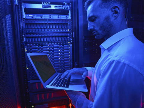 Technician in a server room working on Computer Security in Atlanta, GA